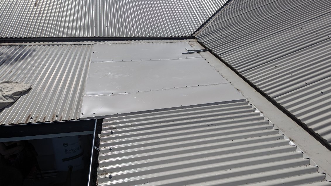 The same roof patch from another angle, screwed down along each edge